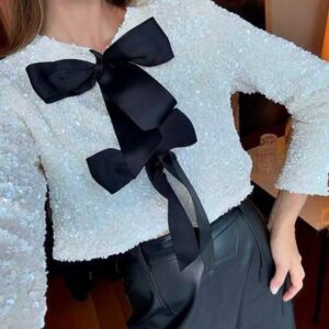 Chaqueta de lentejuelas plata con lazos.