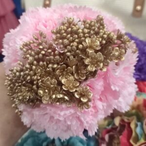 Flor de flamenca rosa con dorado